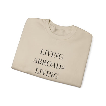 Crewneck Sweatshirt — "Living Abroad > Living Exhausted"